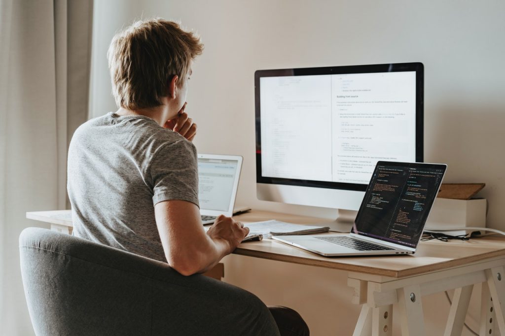 Man Thinking in Front of the Computers