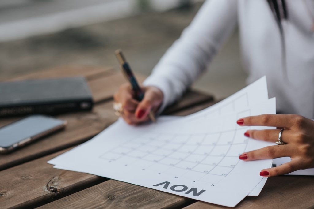 A Woman Is Writing on the Calendar