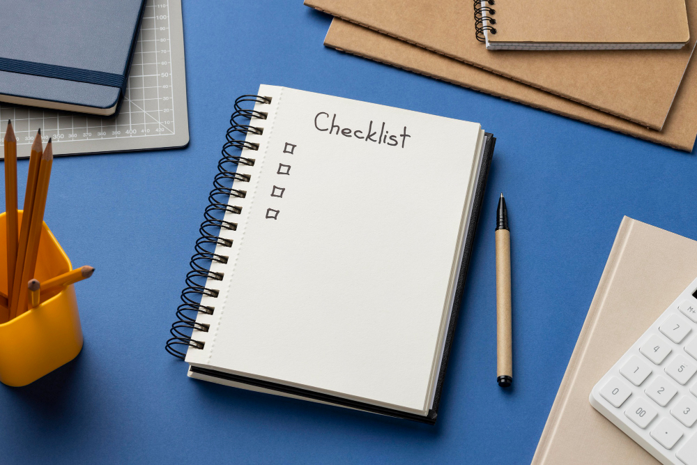 Top View Notebook With Checklist on Desk 