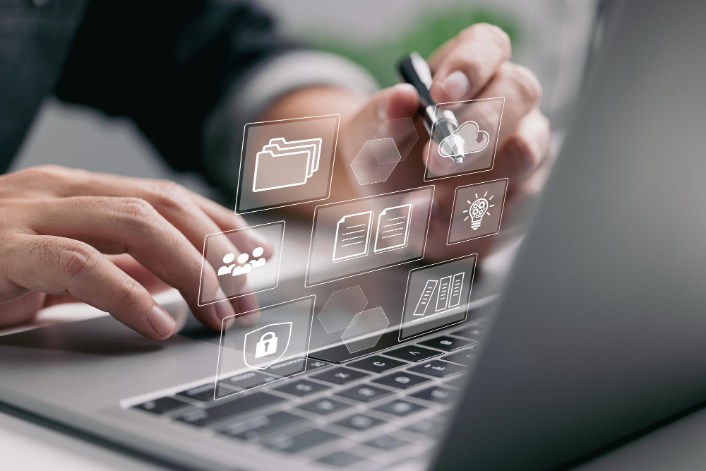 A Businessman Uses a Laptop With Simulated Digital Screen Icons To Do Work