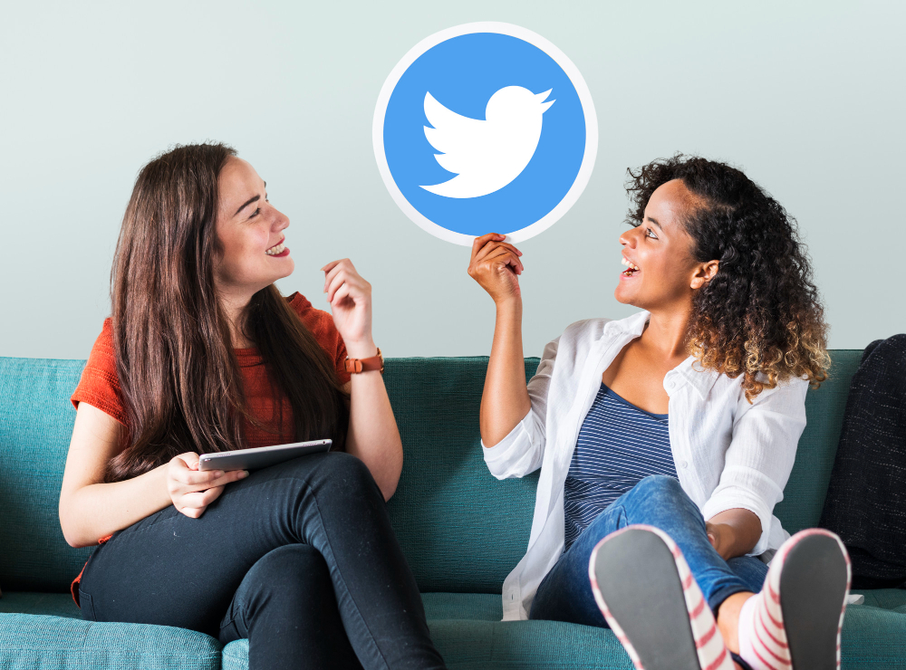 Young Women Showing a Twitter Icon