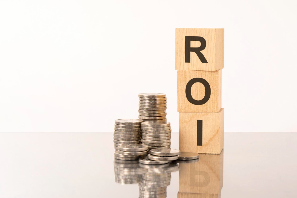 ROI Text on Wooden Cubes on White Background With Coins