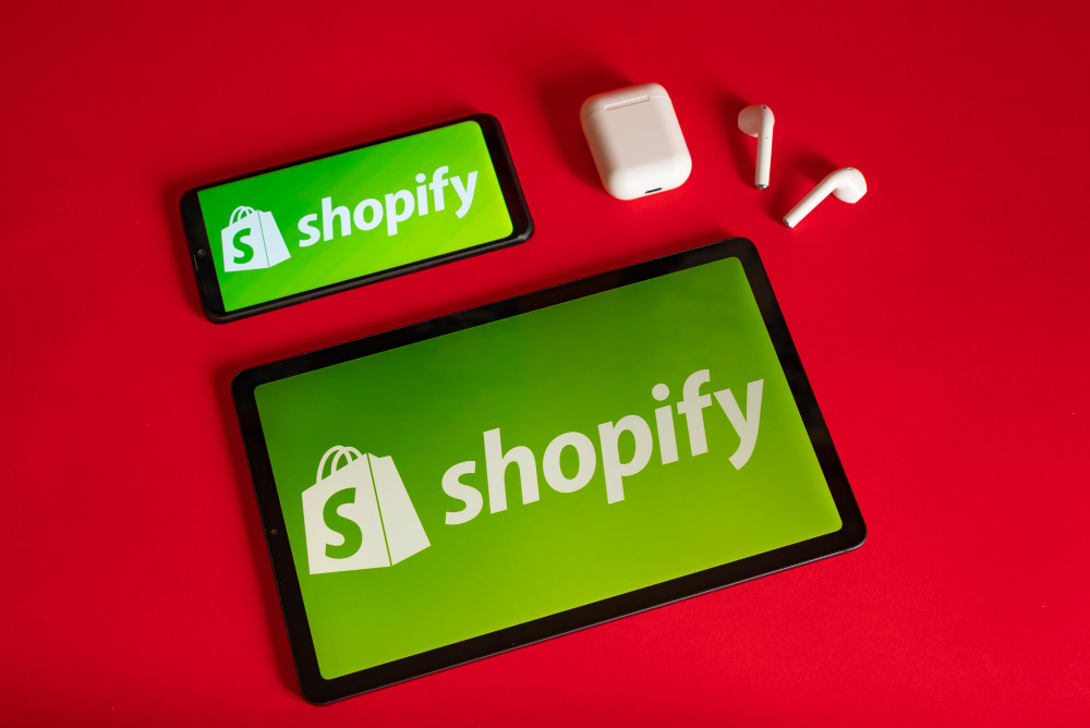 Shopify Web Page Displayed on a Modern Laptop Smartphone and Notebook