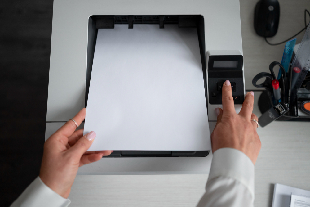 Woman Using Printer While Working in the Office