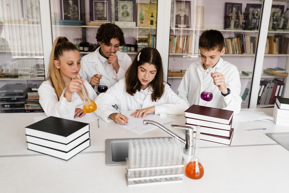Schoolchildren Studying at Chemistry Lesson in Classrom
