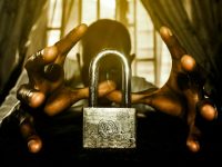 a person holding a padlock in front of a window cybersecurity,data encryption,payment security