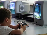 a young boy playing a video game on a nintendo wii kids,learning,interactive,games