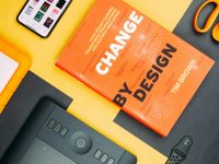 Change by Design by Tim Brown book beside smartphone email marketing platform campaign design crm