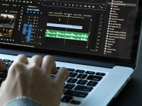 person using MacBook pro turned on snap save, pinterest video, downloading content