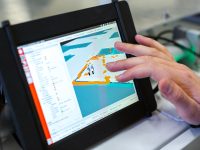 person holding black tablet computer streaming setup, obs software, video production