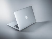 silver macbook on white table real estate crm dashboard, agent working on laptop, sales pipeline