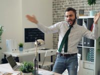a man in a tie is dancing in an office sales team crm software happy office charts