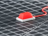 a red and white house on a graph paper property valuation, house price, market trends