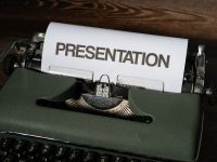 a typewriter with a sign on it canva presentation, graphic templates, business slides