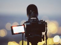 black dslr camera on tripod AI video software, video editing, digital media