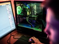 a person is working on a computer with a mouse PC gaming, steam deck, stray game, crash