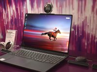 Laptop displaying a horse racing on its screen. lenovo yoga, person drawing, convertible laptop