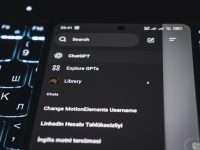Smartphone screen displaying chatgpt interface on keyboard gta v settings menu, pc graphics options, low settings example