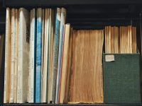 a book shelf filled with lots of books data catalog, glossary, ownership structure