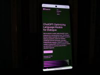 a cell phone with a lit up screen in the dark openstreetmap smartphone interface gps
