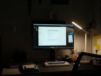 a computer monitor sitting on top of a desk workflow optimization, productivity setup, dual screen