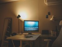 Top 8 Editors With Easy Export & Format Support (4K, 60 FPS, Mobile-Ready) Preferred by Reddit YouTubers Running Multi-Platform Channels a desktop computer sitting on top of a white desk video editing, desktop software, timeline interface