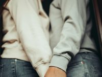 a man and a woman kissing in front of a door intimacy, consent, relationships