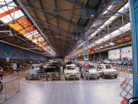 A parking garage filled with lots of cars global car production assembly nissan