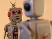 How ChainOpera AI Enhances Smart Contract Automation a robot keychain that has a robot on it ai language models, human vs machine, content creation