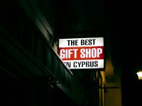 a sign on a building american express website, gift card, check balance