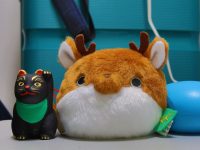 a stuffed animal is next to a toy cat ai animation, lora video, deforum, cat dragon