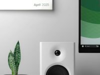 A white speaker stands beside a potted plant. office365 onedrive integration, canvas interface, mp4 icon