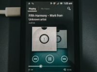 When Does Spotify Wrapped Drop? Don’t Miss Your Year In Music black samsung android smartphone with white usb cable libby app interface, ebooks, audiobooks