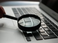 magnifying glass near gray laptop computer php files, search query, cyber reconnaissance