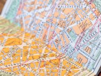 A close up of a map on a table colorful map, custom map design, digital cartography