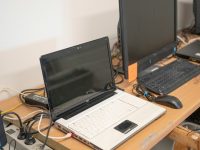 720p for Esports Streams: Latency Over Resolution a desk with two laptops and a keyboard on it office network, computers connected, home router