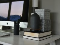 a desktop computer sitting on top of a white desk modern router, mesh wifi, living room
