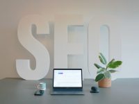 a laptop computer sitting on top of a desk wordpress seo, google ranking, website traffic