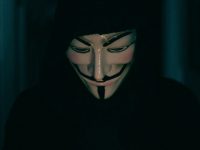 a person wearing a mask using a cell phone vpn browser, encrypted connection, anonymous browsing