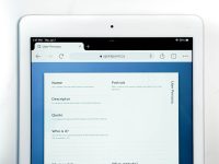 a white rectangular device with a screen outlook interface, recent files, attaching documents