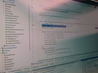 Computer screen showing lines of code. seo dashboard, page rank tools, analytics graphs