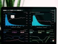 graphs of performance analytics on a laptop screen real time dashboard, cloud software, attendance tracking