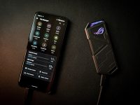 black remote control on black textile motorola smartphone fastboot usb cable