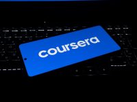 Coursera logo on a laptop keyboard global learning, students, online access, education technology