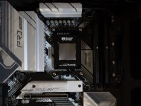 Here’s a caption: an asrock motherboard is shown in detail. corsair aio cooler pc build