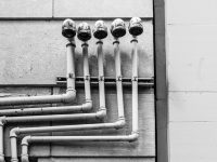 Pipe Operating System So Smart It Might Start Fixing Your Pipes Too white and black metal pipe smart plumbing, pipe sensors, water technology