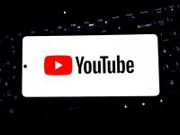 Youtube logo displayed on a smartphone screen. twitch vod downloads export youtube