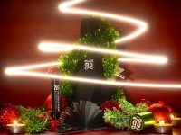 A christmas tree made out of a black box seasonal facebook cover, branding refresh, event promotion