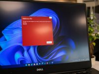a dell laptop computer with a red screen computer login screen, api key settings, credentials error