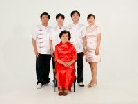 Family posing in traditional chinese attire family nurse practitioner, primary care, patient consultation